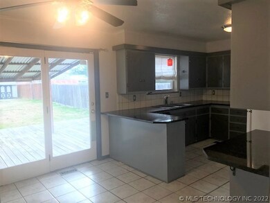 Second view of kitchen including kitchen dining ar