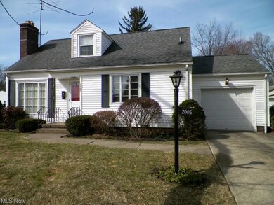 View of house from driveway. Newer vinyl siding, u