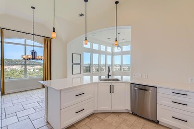 Kitchen featuring light countertops, visible vent