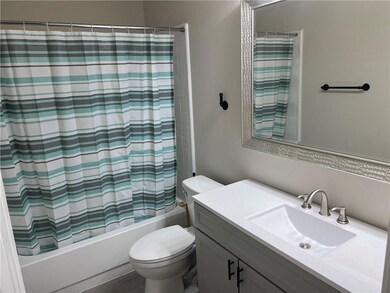 Bathroom featuring vanity and shower / bath combo