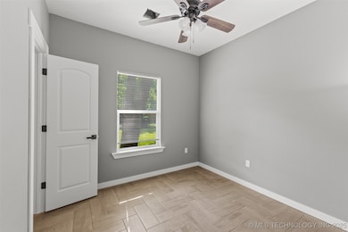 Unfurnished room featuring baseboards and ceiling