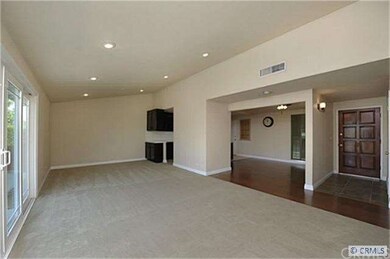 Living room looking into dining room and kitchen.