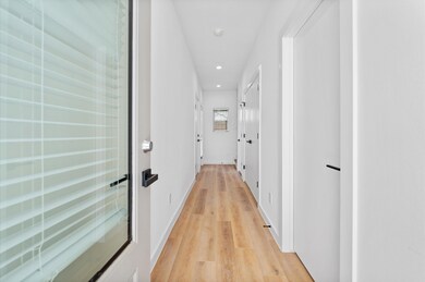 Entry way with access to garage, third bedroom and