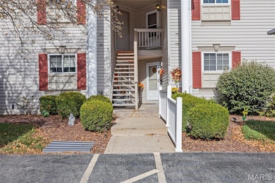 Doorway to property featuring uncovered parking