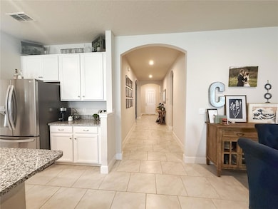 Kitchen, Dining room, Entry hallway that leads from Living room to Bedrooms 2-4 and bath 2, extra tall ceilings and doors, 5 1/4” baseboards