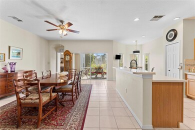 Large open floor plan leading from kitchen to dining room with sliding doors leading to large lanai with golf course views. Easily set up as large family room for entertaining.