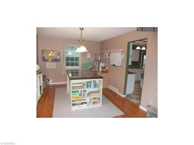 Hardwood floors flow into the home's dining room (