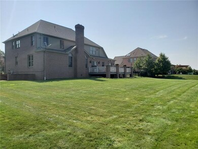 Large, flat backyard with side entry stairs with F