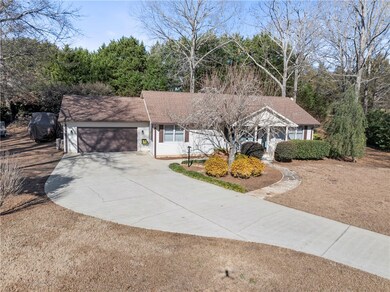 Level lot with manicured landscaping.