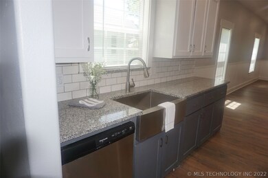 Granite Counters, Tiled Backsplash, stainless sink