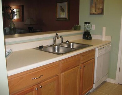 Kitchen. Open to living area with breakfast bar.