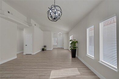 Entryway featuring a chandelier, visible vents, ba