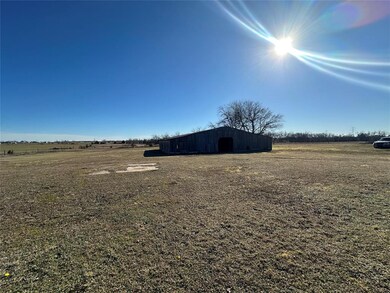 View of yard with an outbuilding and a rural view