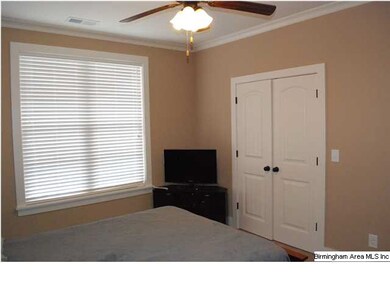 A spacious master bedroom with large closet.