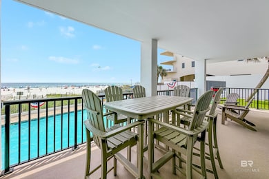 Balcony featuring a water view and a view of the beach