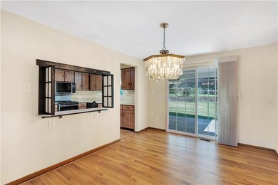 Dining room open to kitchen for convenient serving