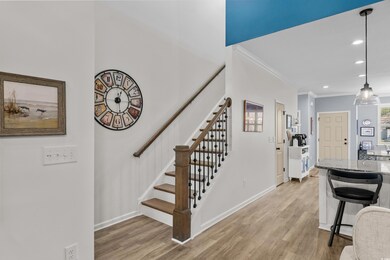 Staircase featuring recessed lighting, ornamental 