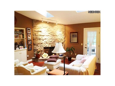Family Room with floor to ceiling stone fireplace,