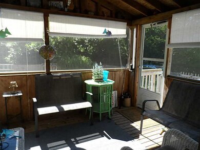 Porch. Entry to the screened front porch