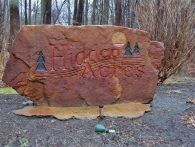 Hidden Acres front boulder sign