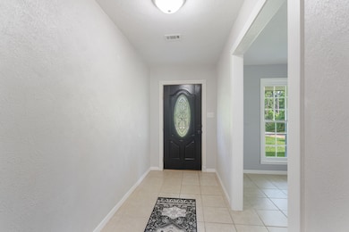 Family room is just off the large entry hall.