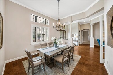 Dining Room with Wood Floors, Plantation Shutters