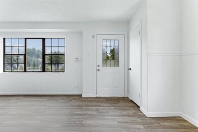 Entrance foyer featuring light wood-type flooring