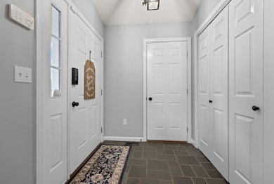 Entrance Front door & Garage with closet hallway storage