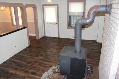 living room w/ wood burning stove