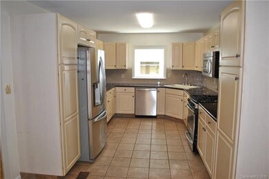 Kitchen with stainless steel appliances, gas range