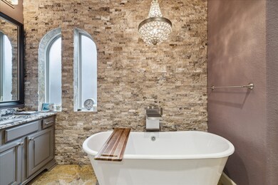 Relax in the pleasing soaking tub with crystal cha