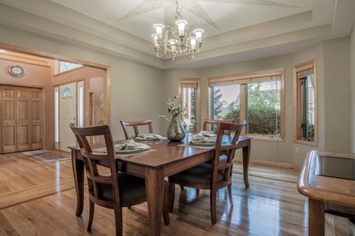 Formal dining room highlights double recessed ceil