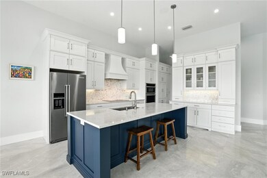 Kitchen featuring high end refrigerator, custom ex