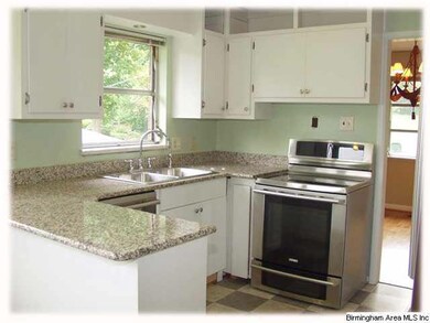 Updated kitchen with granite countertops and stain