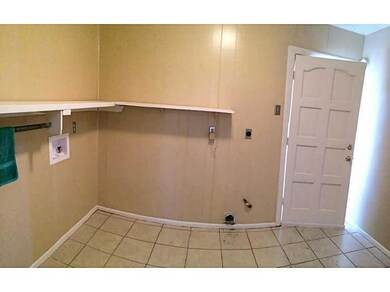 Laundry Room. Inside Laundry room with back yard e