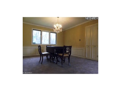 Formal Dining Rooom featuring wainscoating and new