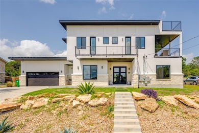 Contemporary house with french doors, a balcony, 