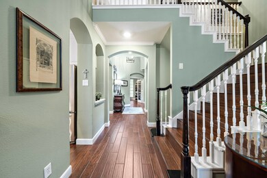 Front entryway with gorgeous stairway leading to 2nd floor.