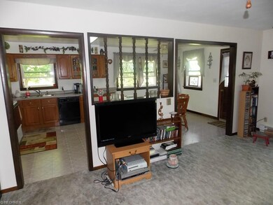 Open concept living room and eat-in kitchen.