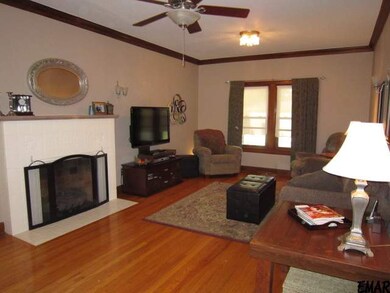 Spacious Living Room has hardwood floors, fireplac