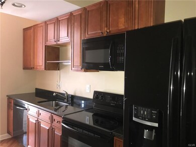 A modern galley-style kitchen greets you.