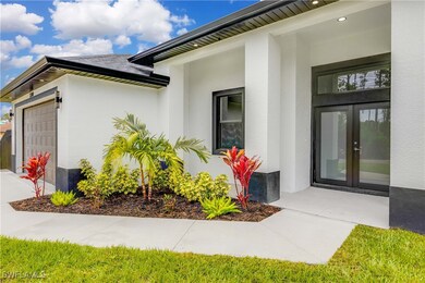 Entrance to property featuring french doors, a gar