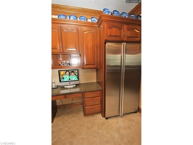 Located off the kitchen is a computer nook w/grani