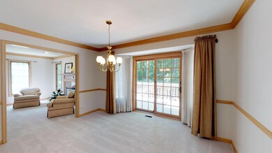Formal dining room with patio door to generous dec