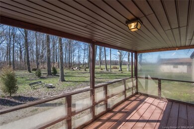 Covered and partially enclosed rear deck.