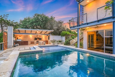 View of pool featuring a patio area and stairway