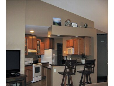 Kitchen area with recessed lighting, oak cabinets 