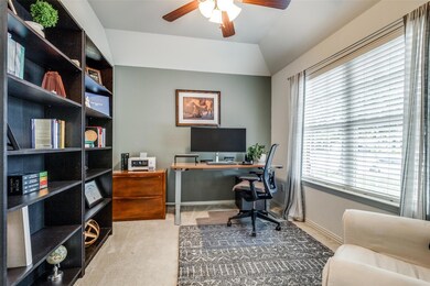 Home office with a ceiling fan, vaulted ceiling, c