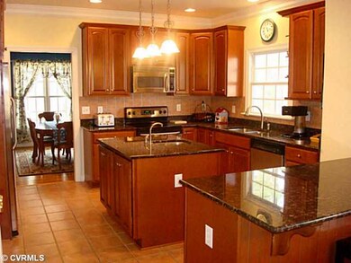 Kitchen - Eat-In Kitchen with granite Counter tops, Stainless Steel Appliances, Prep Sink, Island, Breakfast Bar, and Pantry