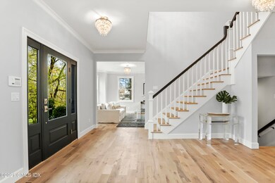 Huge Foyer with Hardwood Flooring